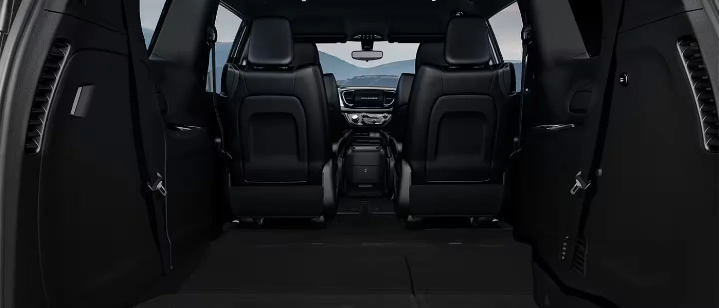 2026 Chrysler Voyager cargo area with folded seats for extra space.